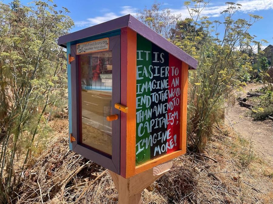A free library with quote on the side