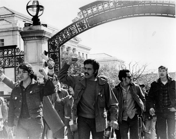 Students march through Sather Gate.